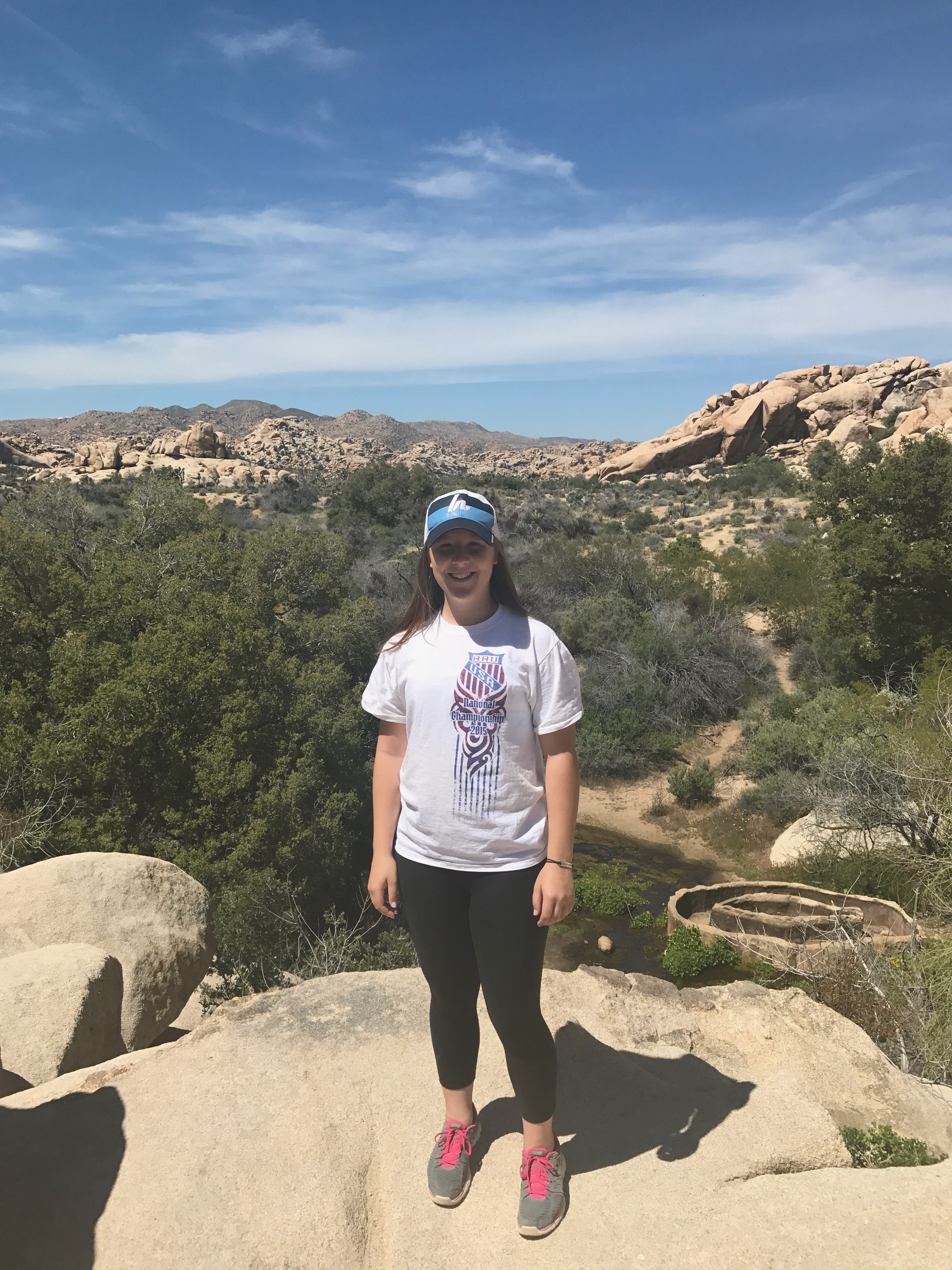 A photo of Ashley on a hike.